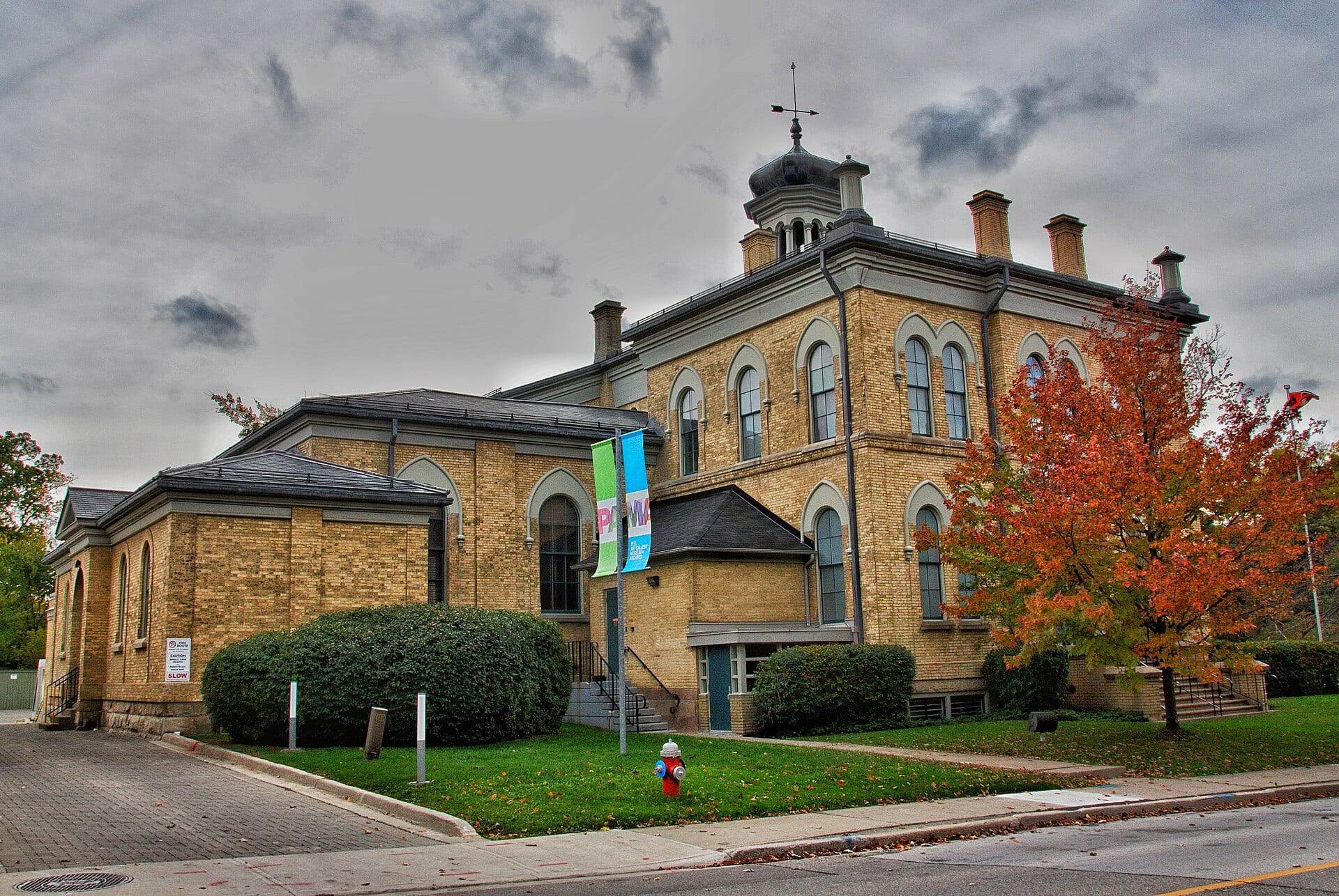 The historic yellow-brick Peel Art Gallery, Museum and Archives building in downtown Brampton in autumn.