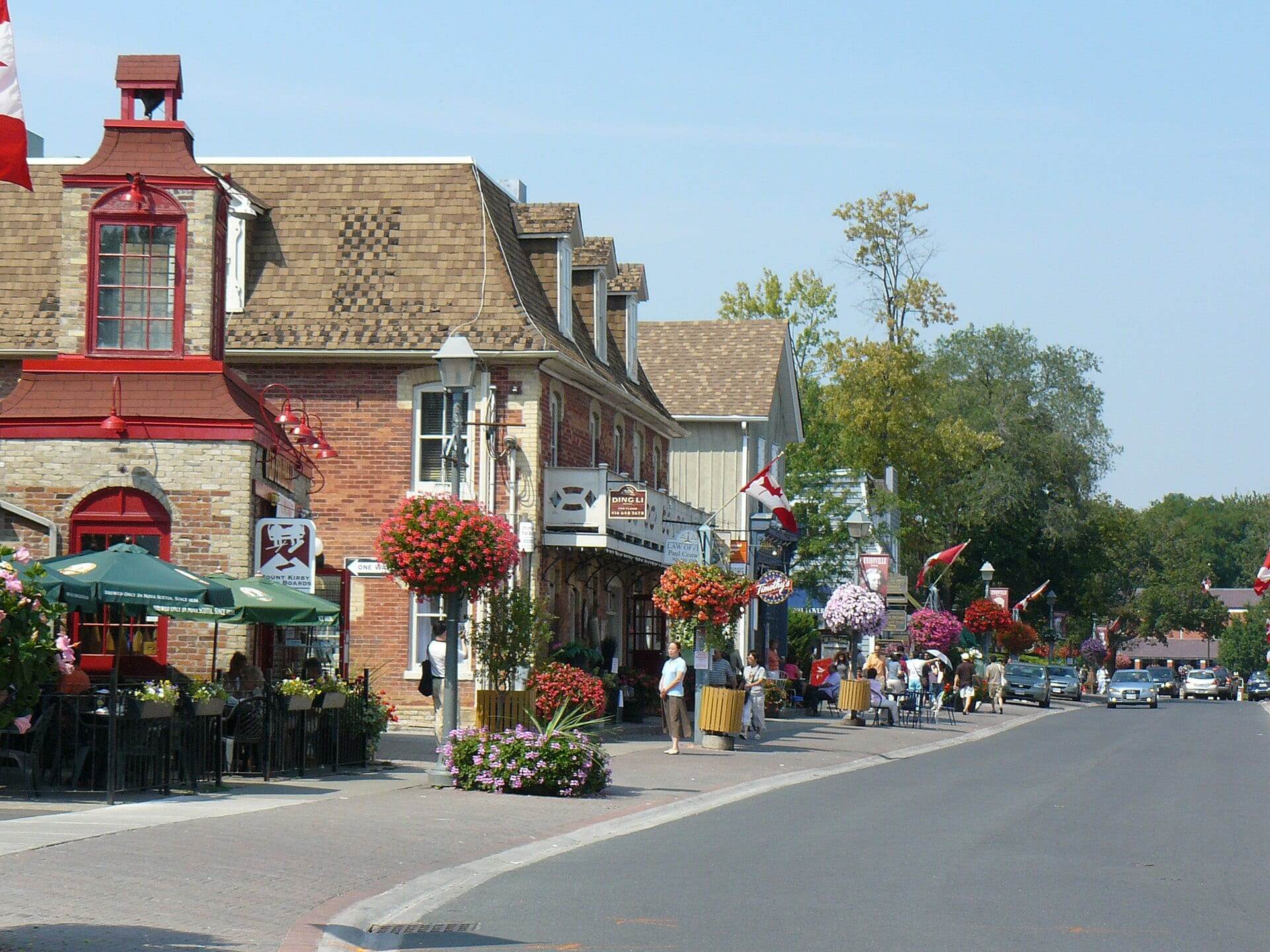 Shops, flower baskets and patios along Main Street Unionville in Markham.